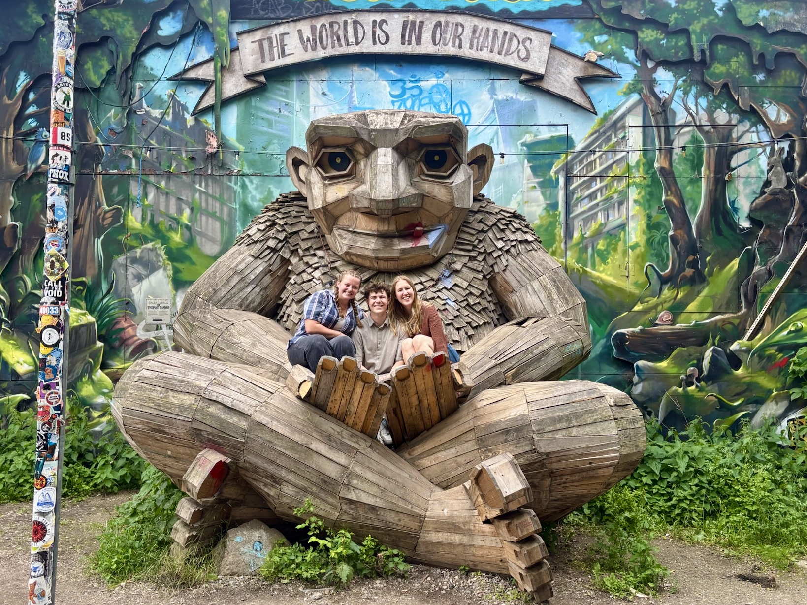 Students sit in troll sculpture in Denmark